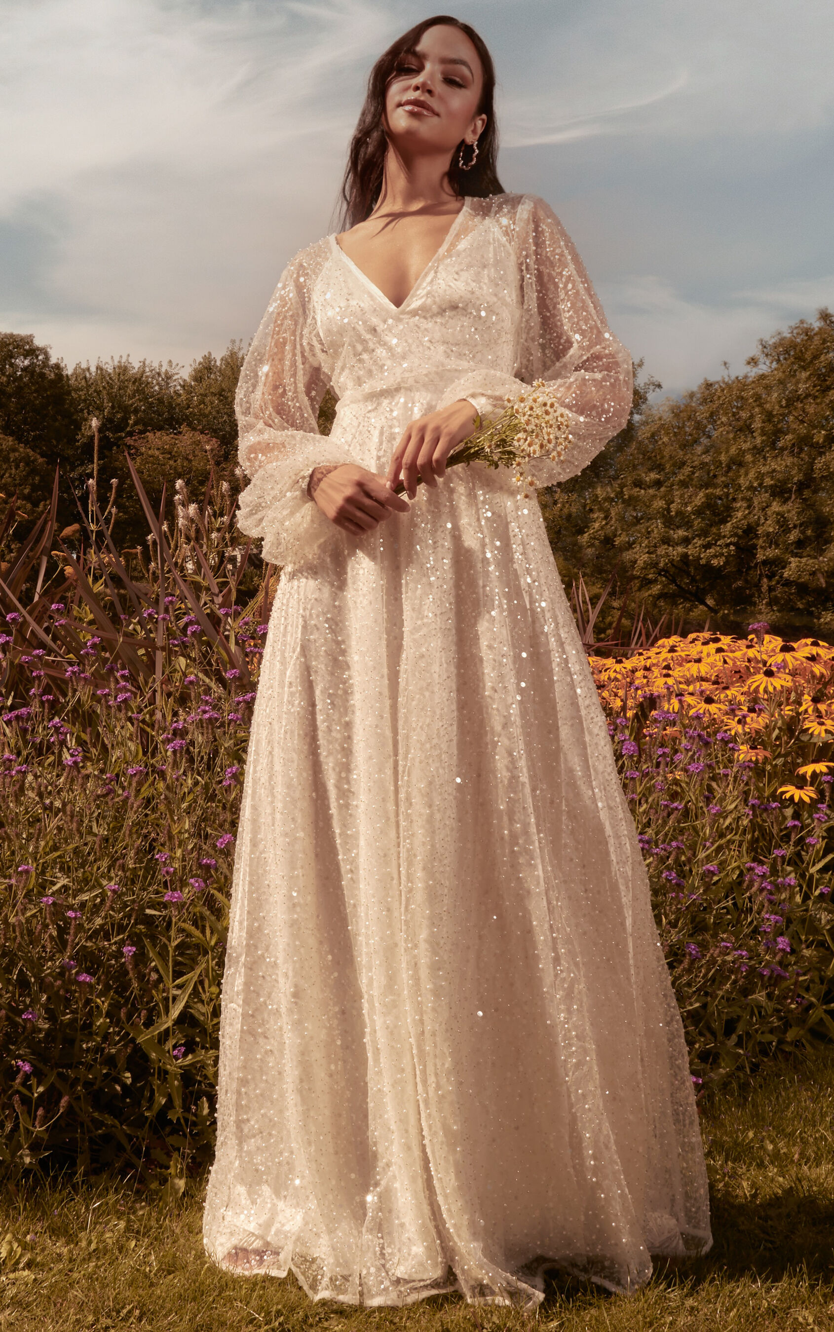 leauna-bridal-gown-sheer-long-sleeve-deep-v-neck-embellished-tulle-gown-in-ivory